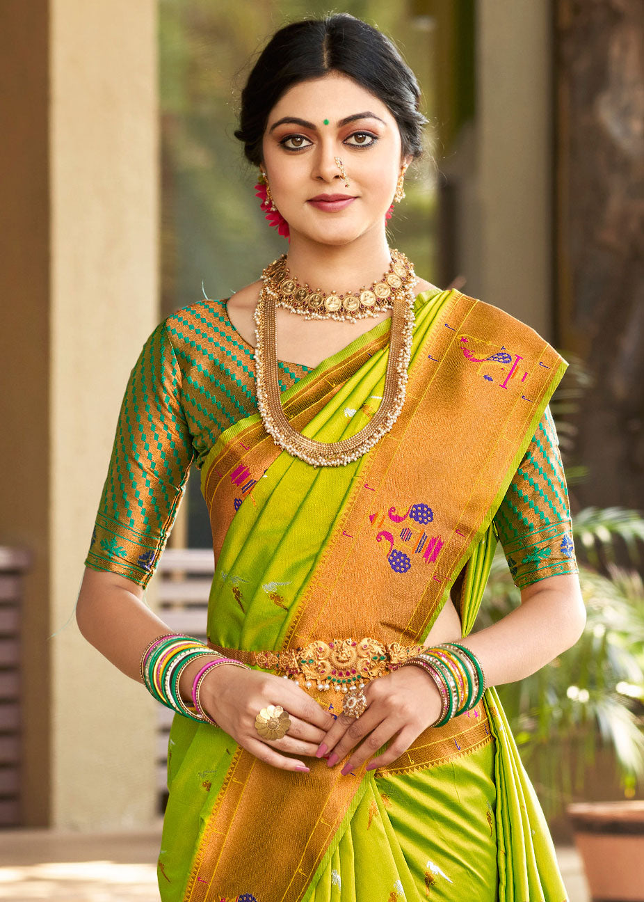 The Yellow with green contrast boarder in maharani paithani silk saree.